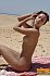 Youthful brunette hair getting naughty and and widening wide on the warm sand. 9 pics
